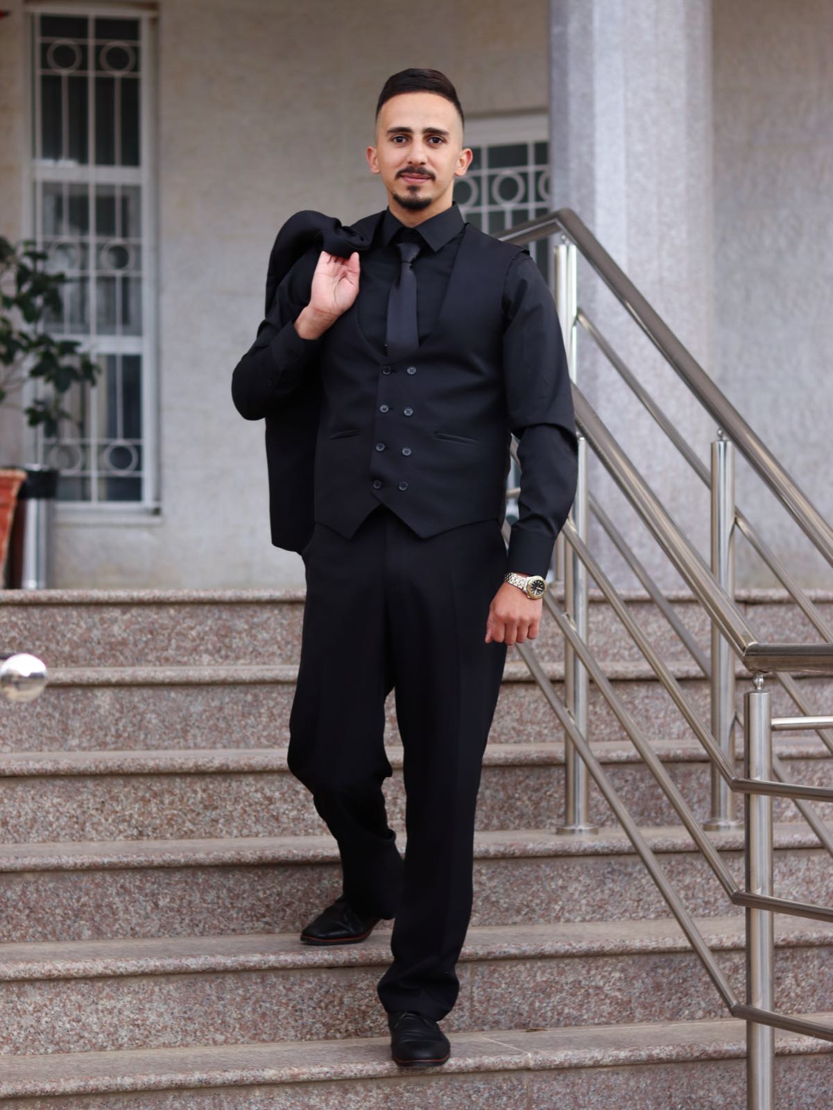 Composed portrait, spare backdrop