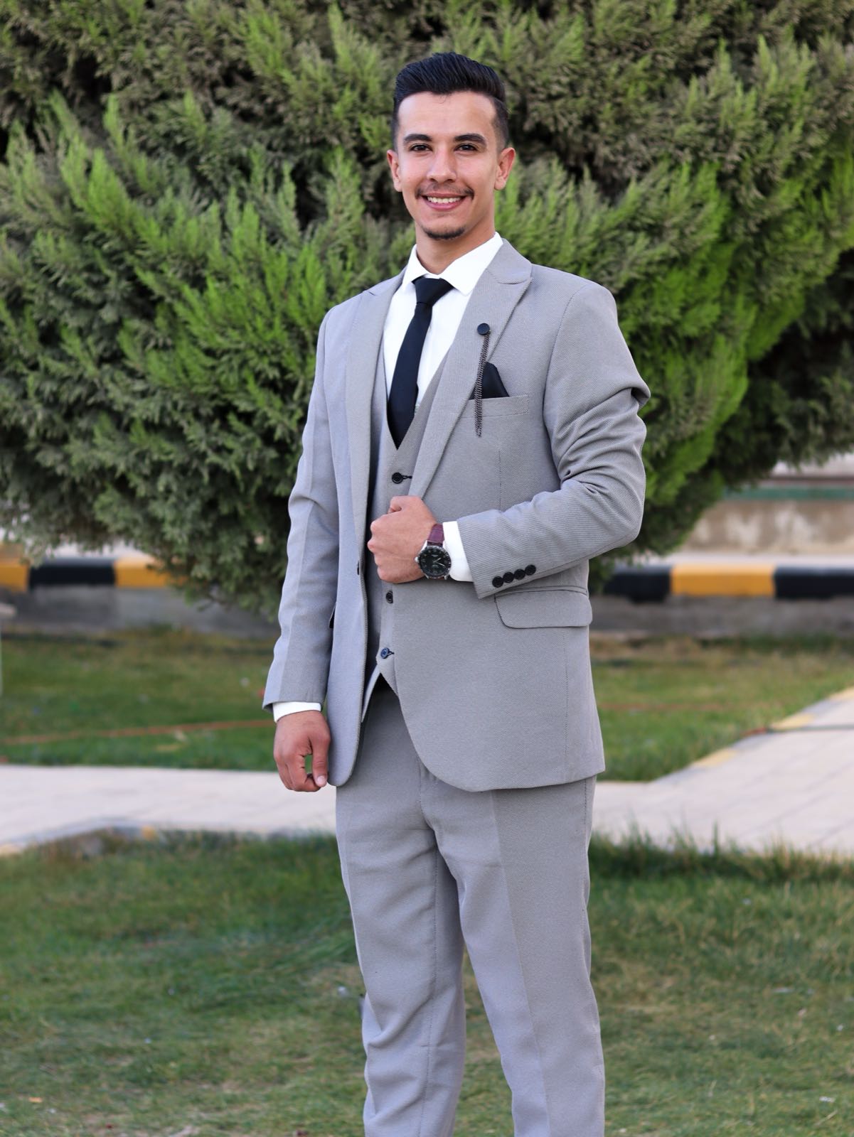 Portrait in grey three-piece suit